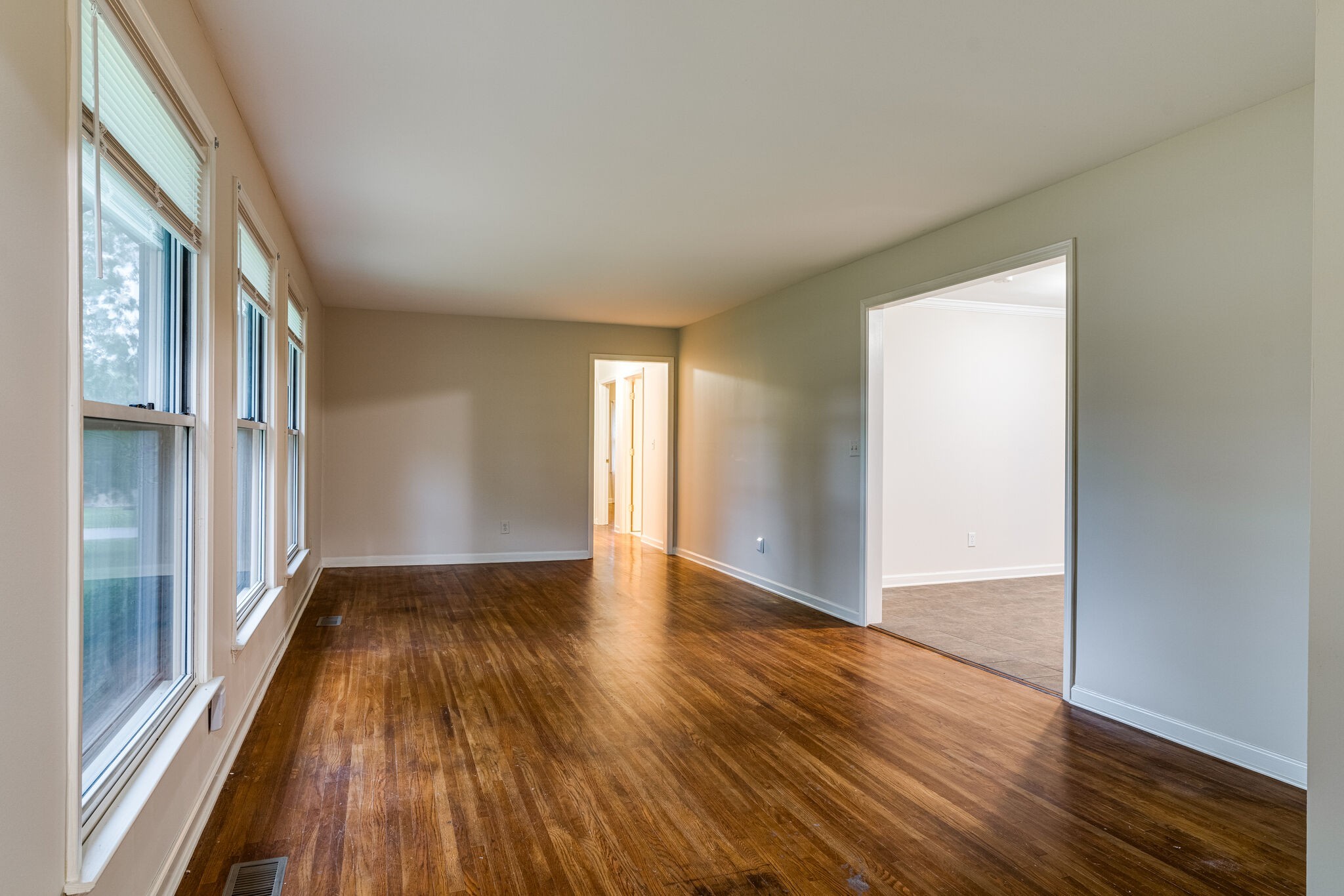 808 Nesbitt Lane Madison, TN 37115 - Photo 8 of 38 a view of an empty room with glass door and wooden floor