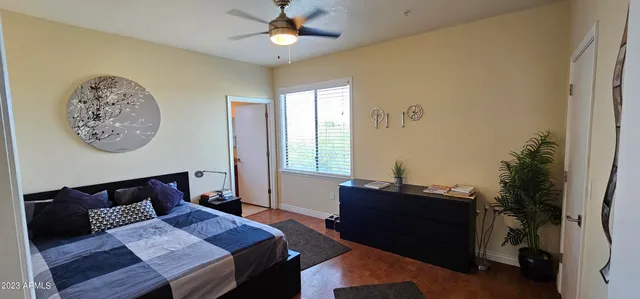 a bedroom with a bed and a window