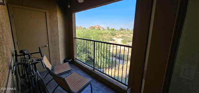 a view of a balcony with chairs
