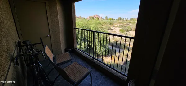 a view of a balcony with wooden floor