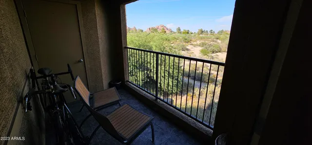 a view of a balcony with wooden floor