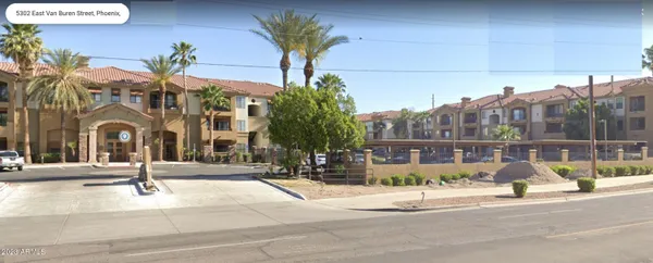 a view of a building with a street