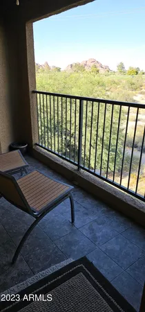 a view of balcony with furniture