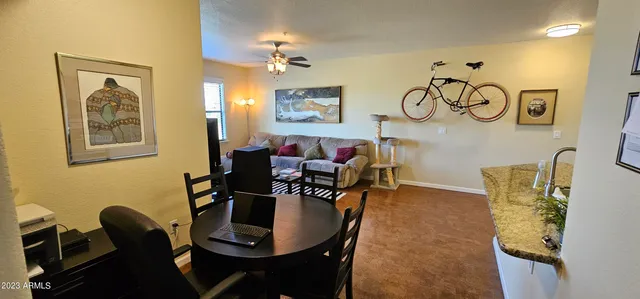 a view of a dining room with furniture and chandelier