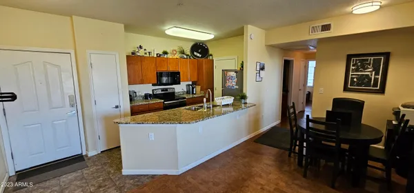 a view of living room filled with furniture and window
