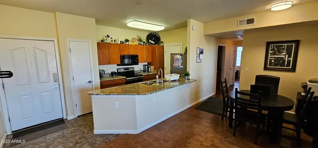 a view of living room filled with furniture and window