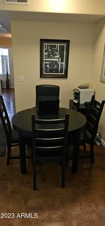 a view of a workspace with furniture