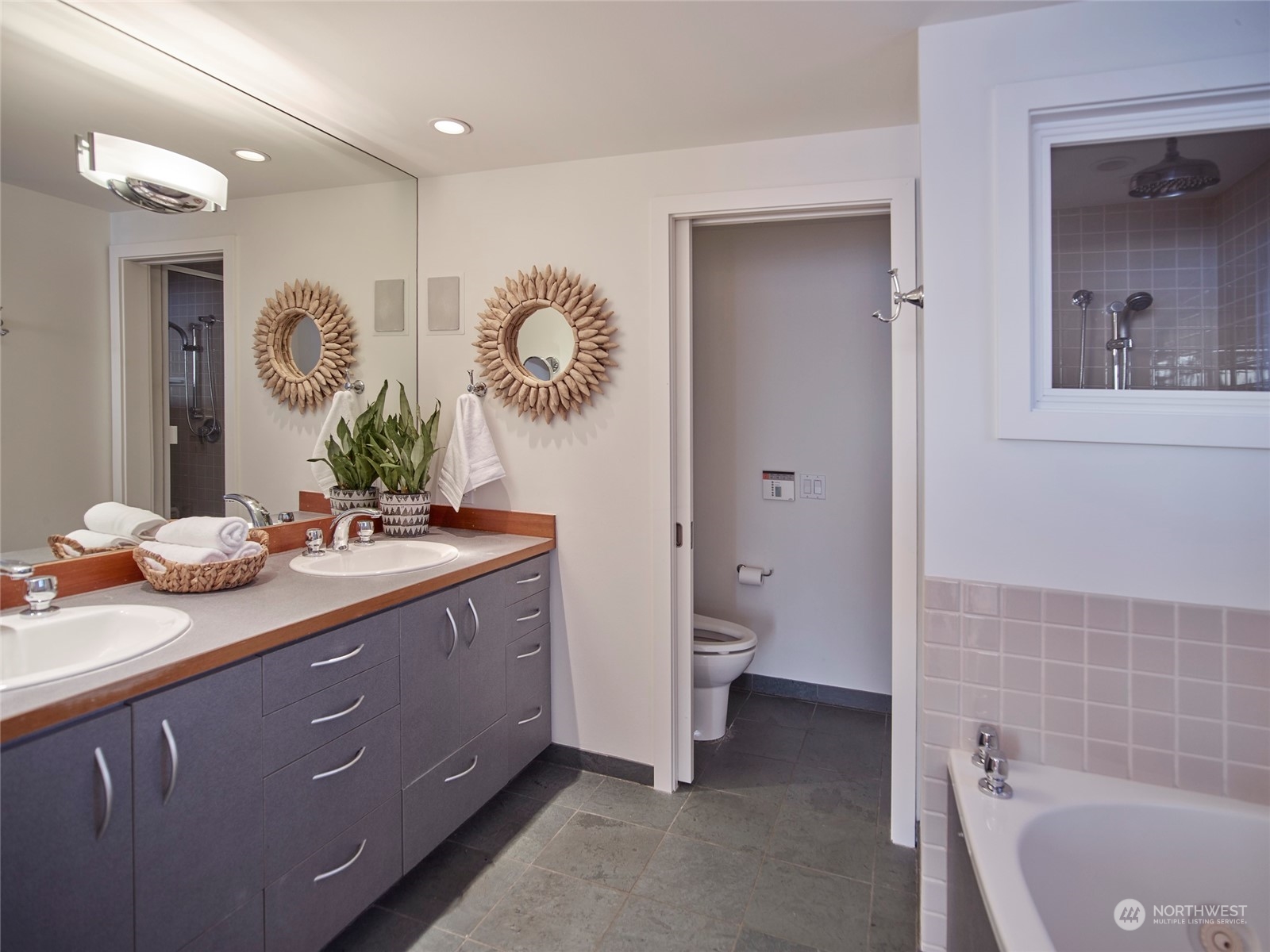 4141 Beach Drive Southwest Seattle, WA 98116 - Photo 18 of 31 a bathroom with a sink and a mirror