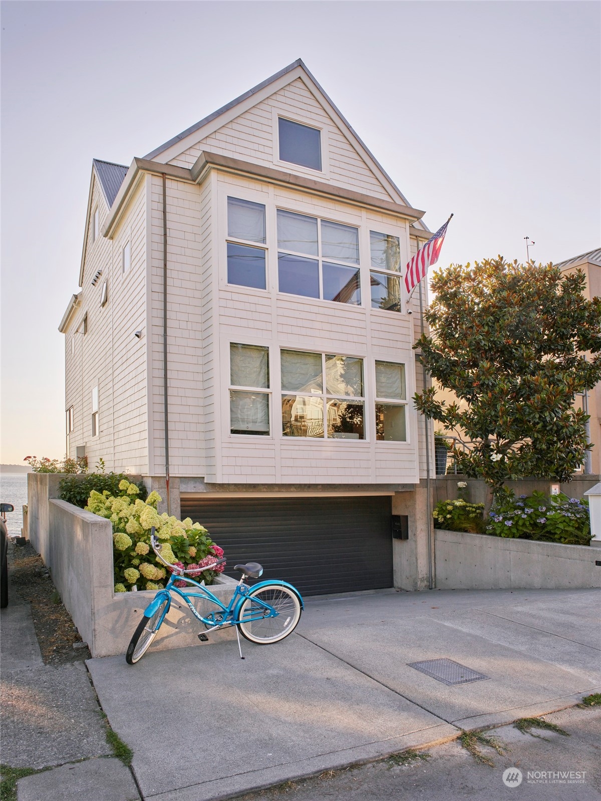 4141 Beach Drive Southwest Seattle, WA 98116 - Photo 2 of 31 a front view of a house with patio