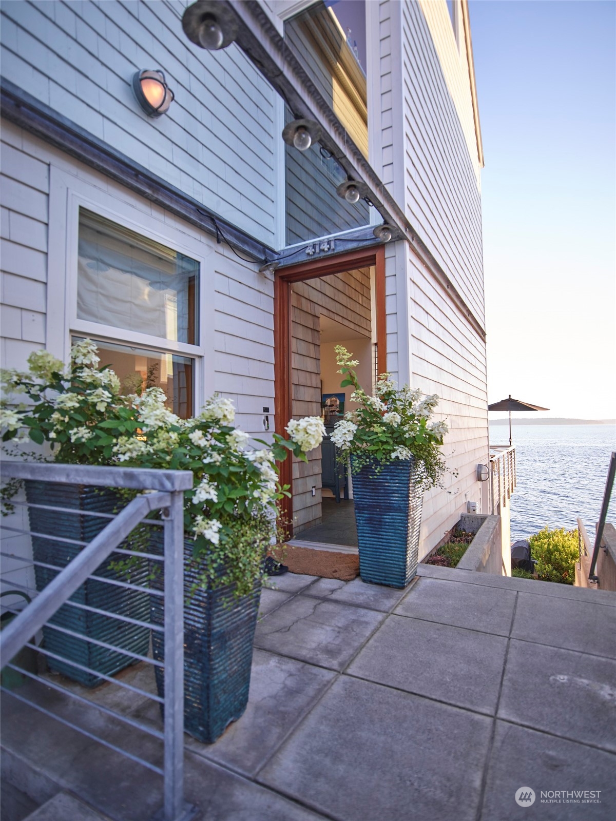 4141 Beach Drive Southwest Seattle, WA 98116 - Photo 5 of 31 a front view of a house with a garden