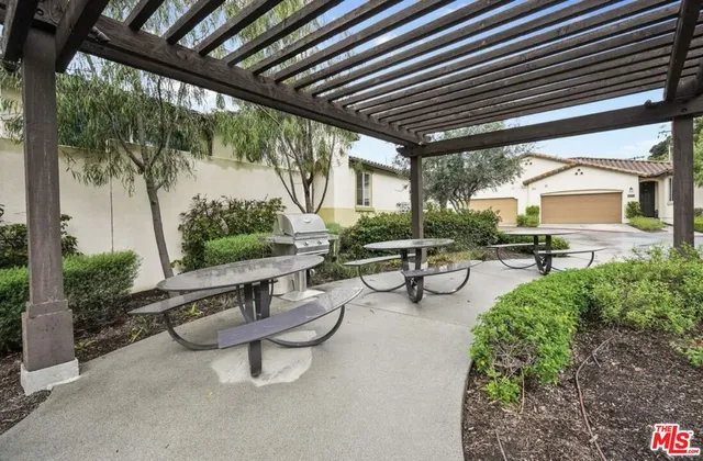 a building outdoor space with patio furniture and a patio