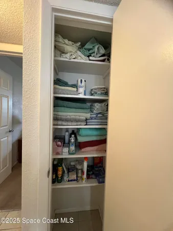 a view of a house with a yard and plants