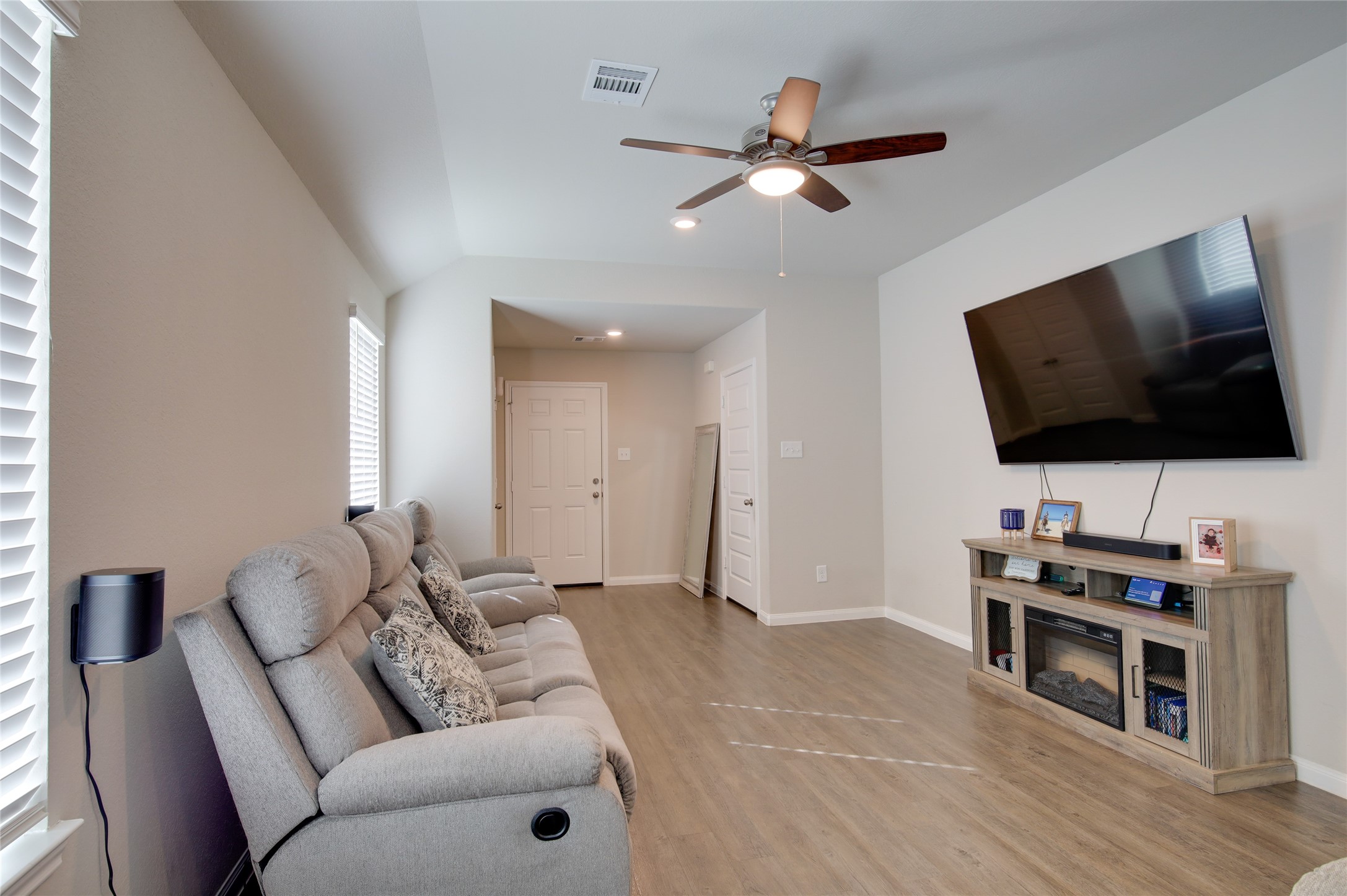 14026 Chinook Drive Conroe, TX 77384 - Photo 11 of 34 a living room with furniture and a flat screen tv