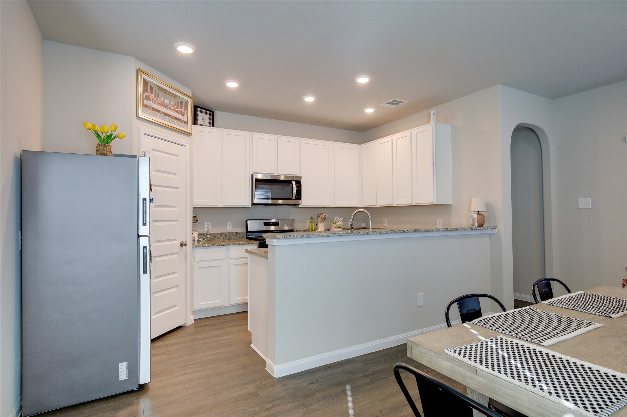14026 Chinook Drive Conroe, TX 77384 - Photo 12 of 34 a kitchen with sink cabinets and refrigerator