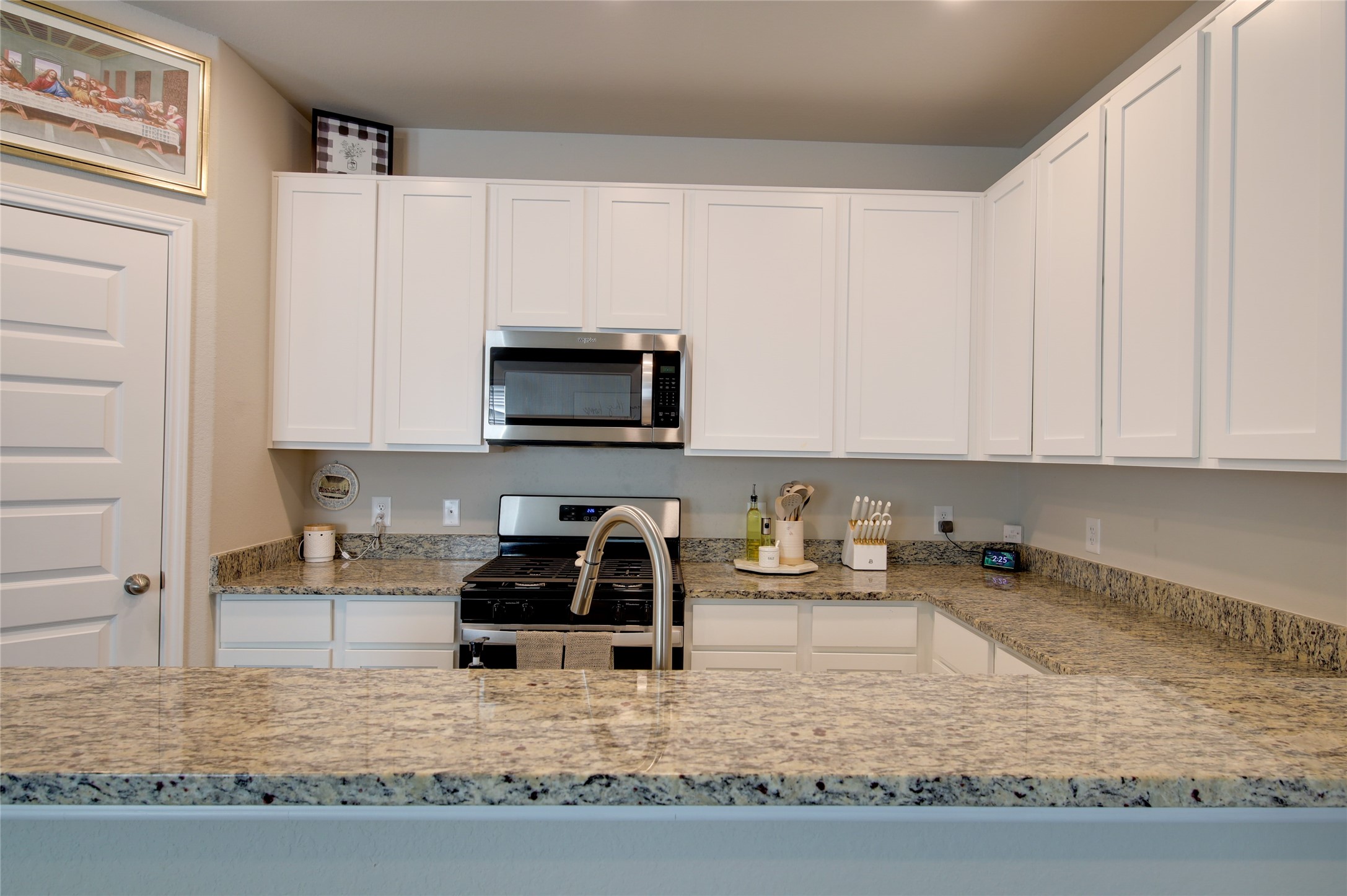 14026 Chinook Drive Conroe, TX 77384 - Photo 15 of 34 a kitchen with stainless steel appliances granite countertop a sink stove and cabinets