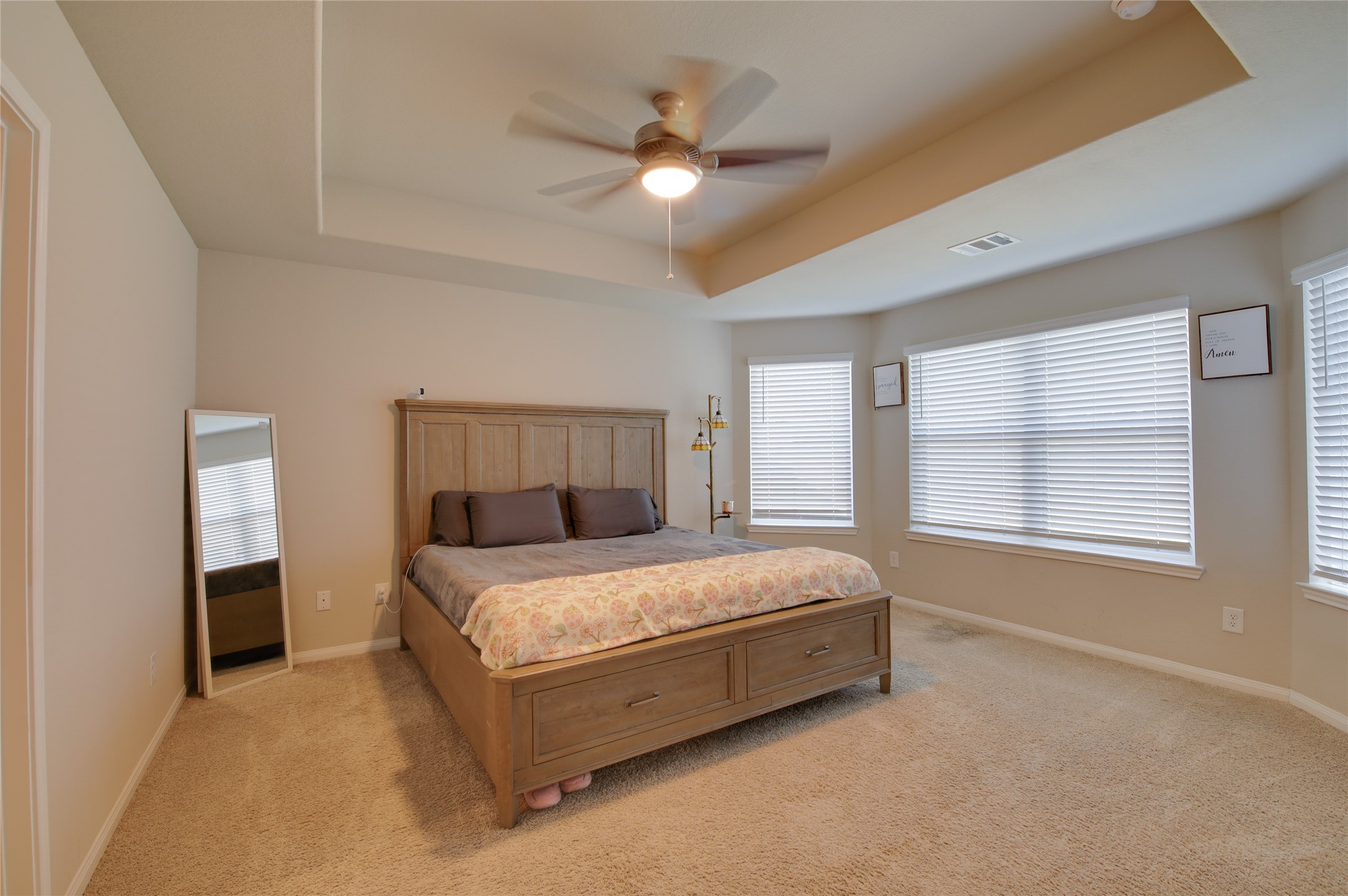 14026 Chinook Drive Conroe, TX 77384 - Photo 19 of 34 a bed sitting in a bedroom next to a window