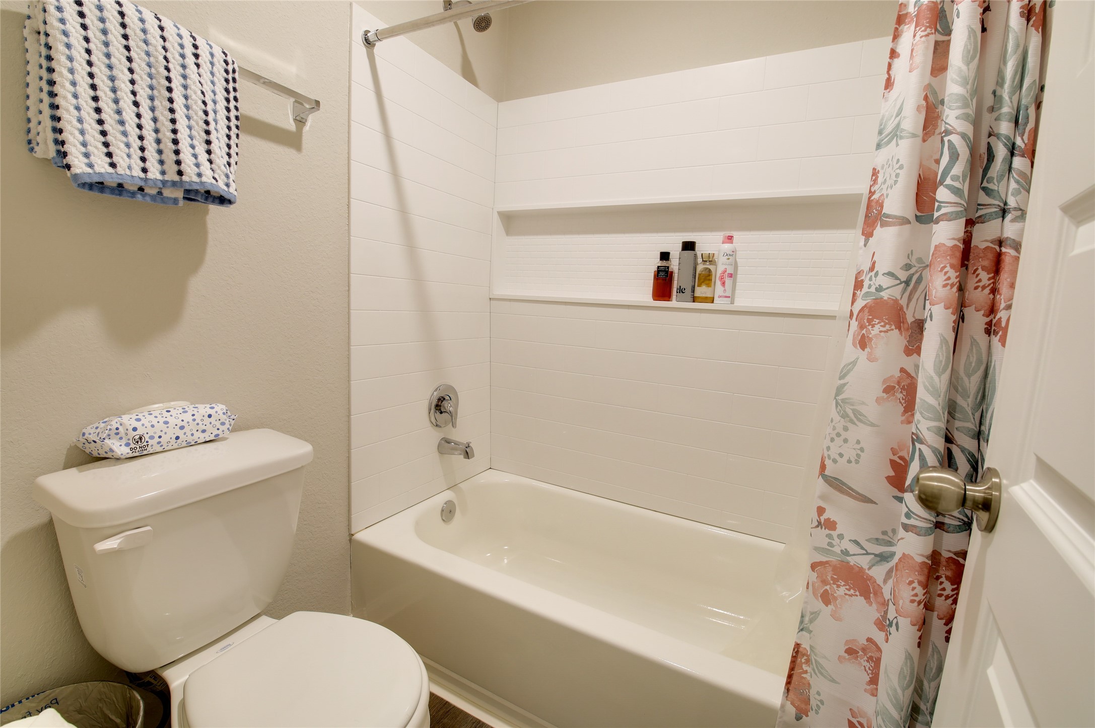 14026 Chinook Drive Conroe, TX 77384 - Photo 24 of 34 a bathroom with a toilet and a shower curtain