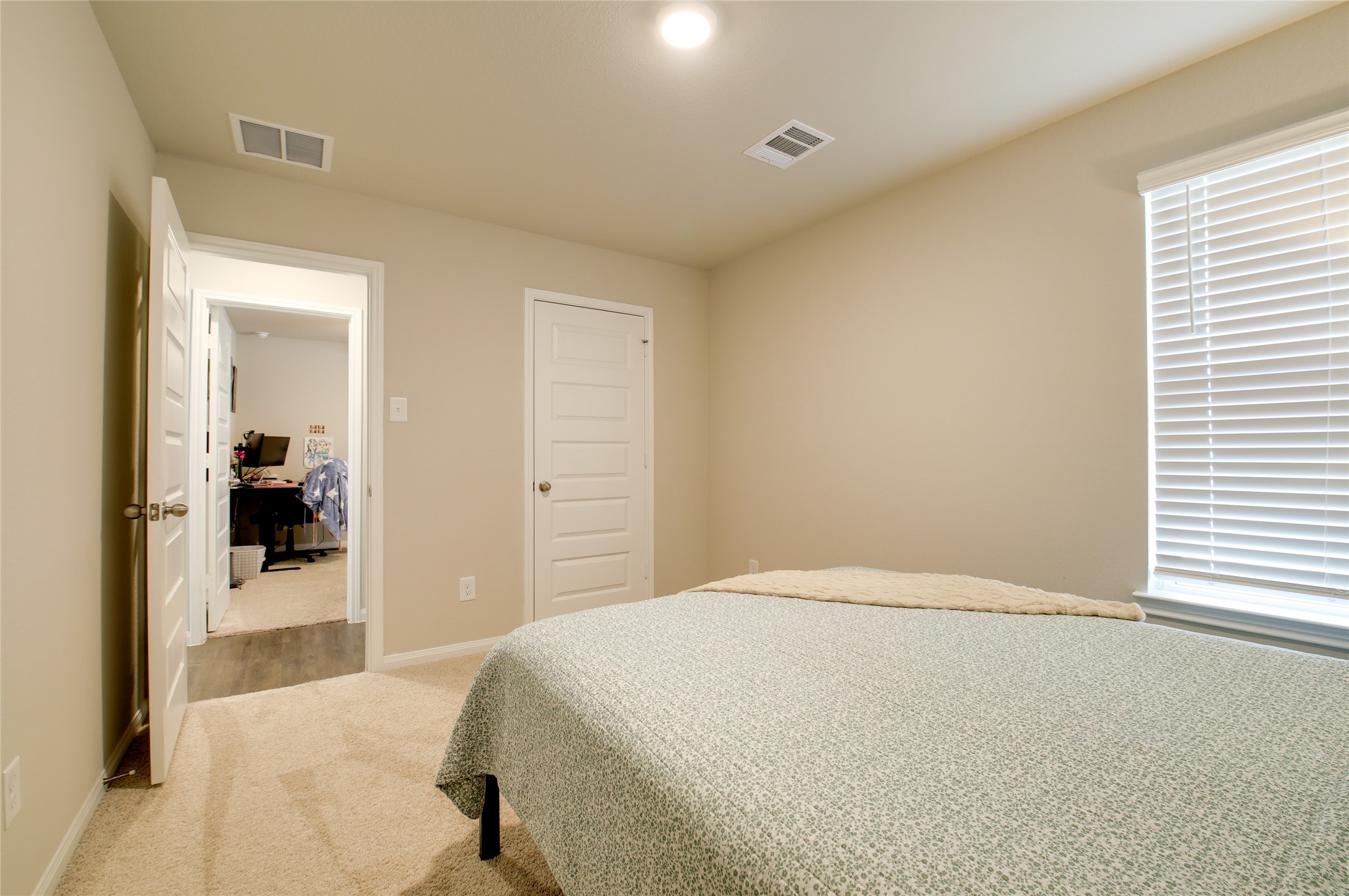 14026 Chinook Drive Conroe, TX 77384 - Photo 26 of 34 a bedroom with a bed and a view of bedroom