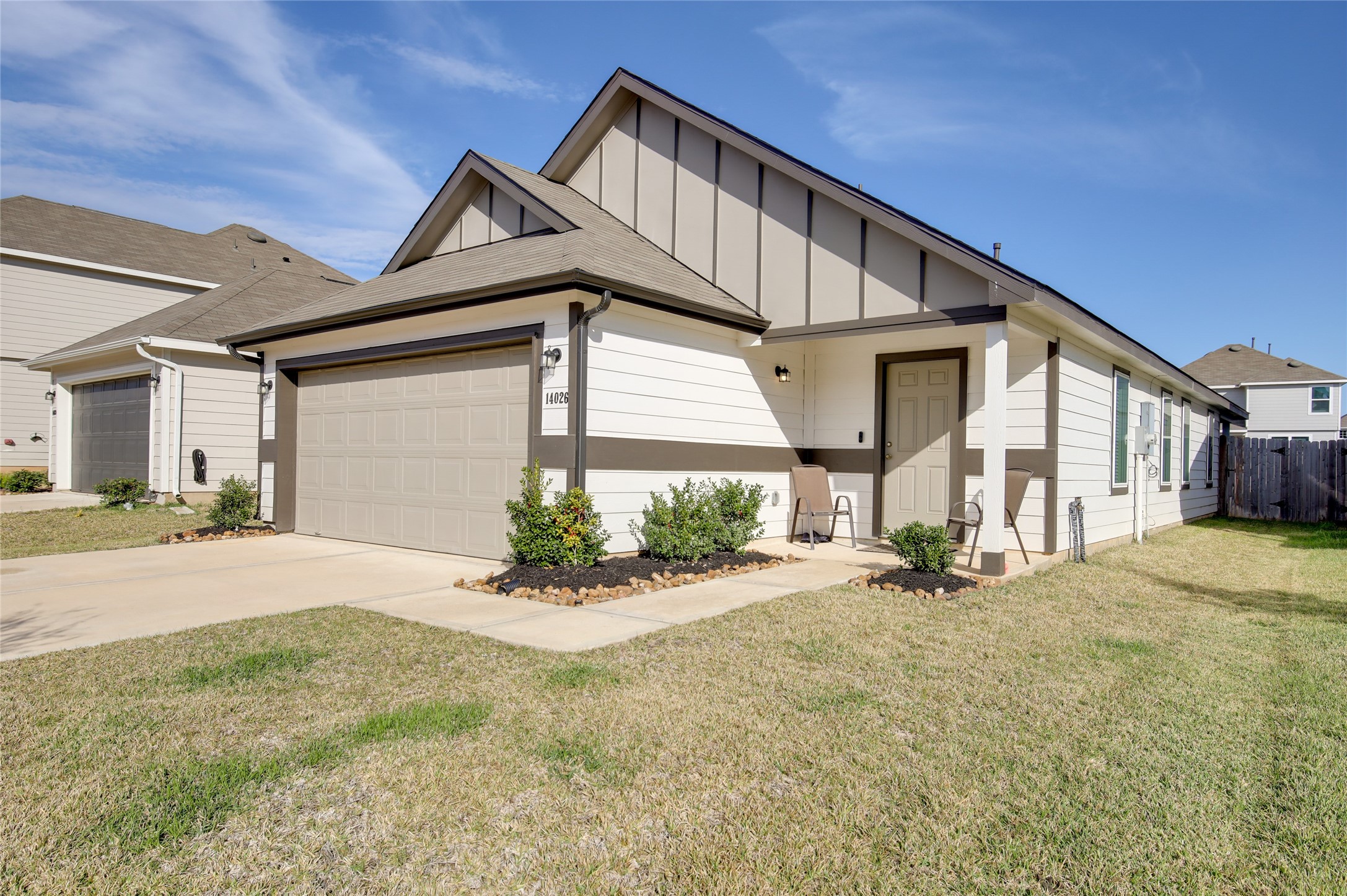 14026 Chinook Drive Conroe, TX 77384 - Photo 3 of 34 a front view of a house with a yard and garage
