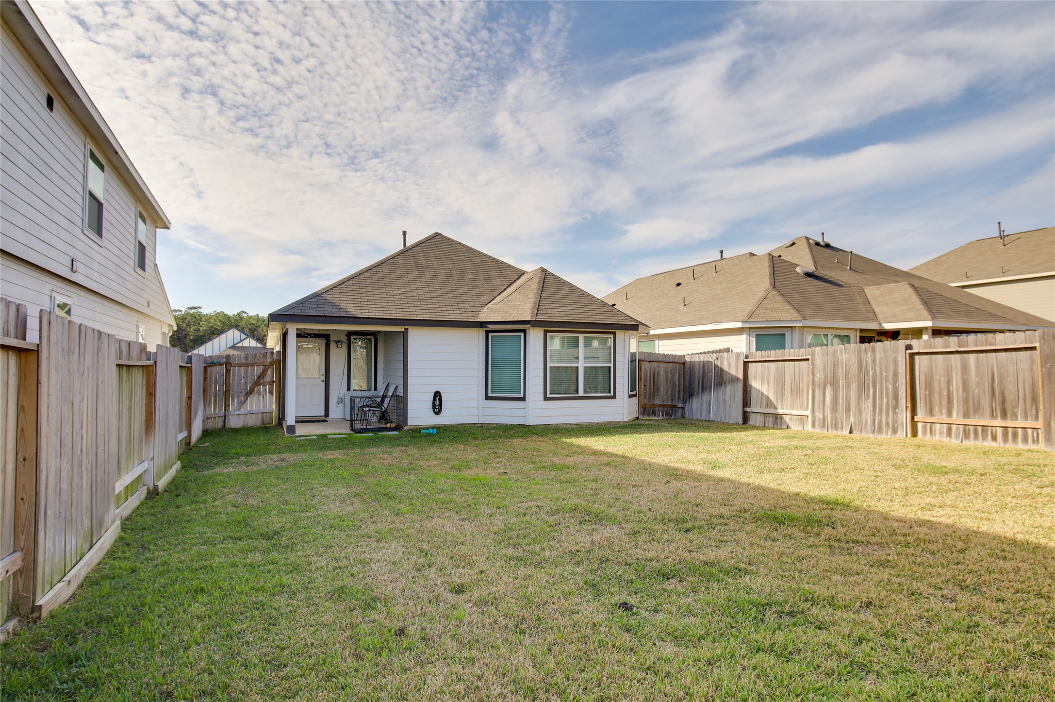 14026 Chinook Drive Conroe, TX 77384 - Photo 31 of 34 a view of a house with a yard and pathway