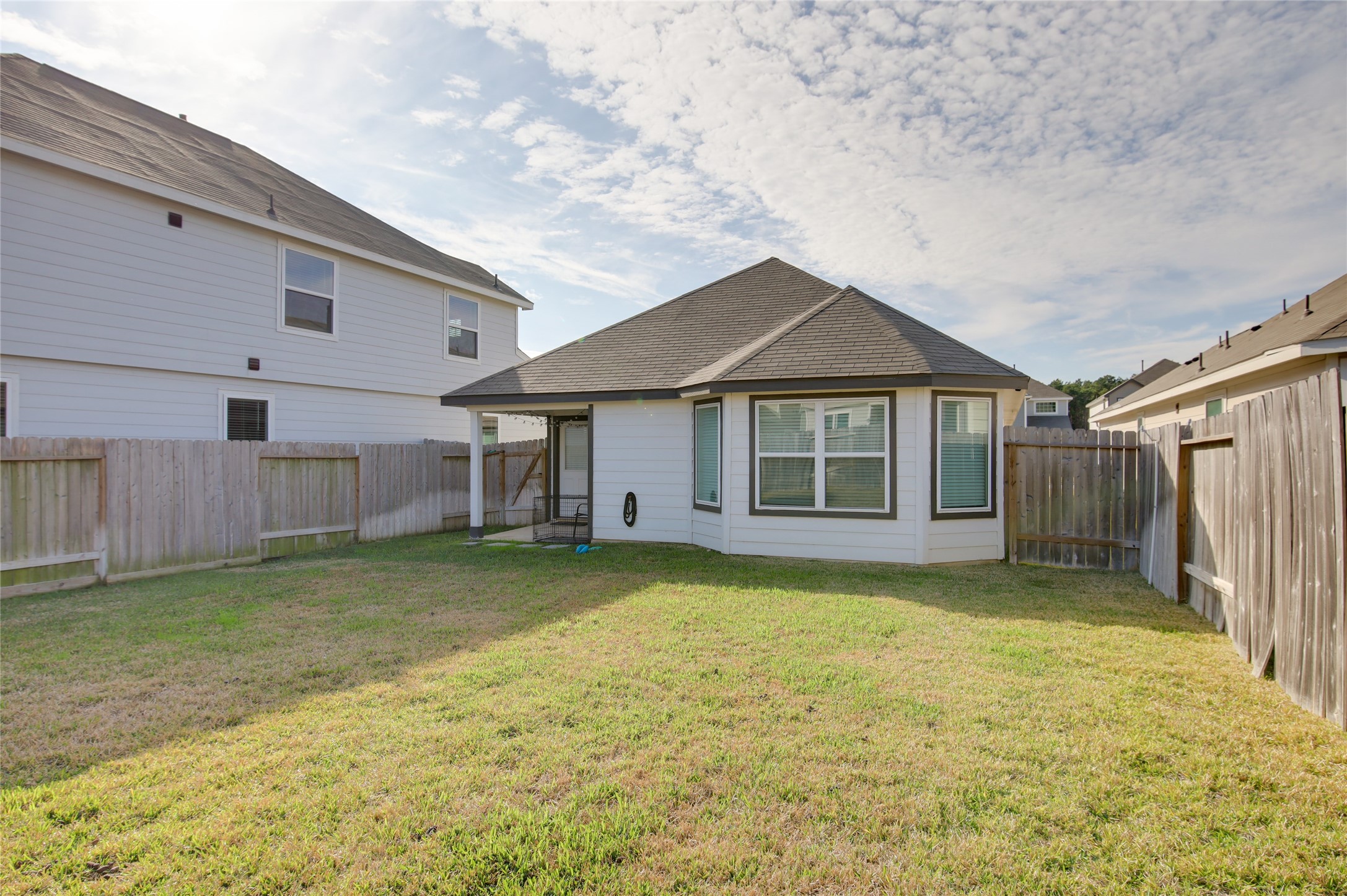 14026 Chinook Drive Conroe, TX 77384 - Photo 32 of 34 a view of a house with a yard and garage