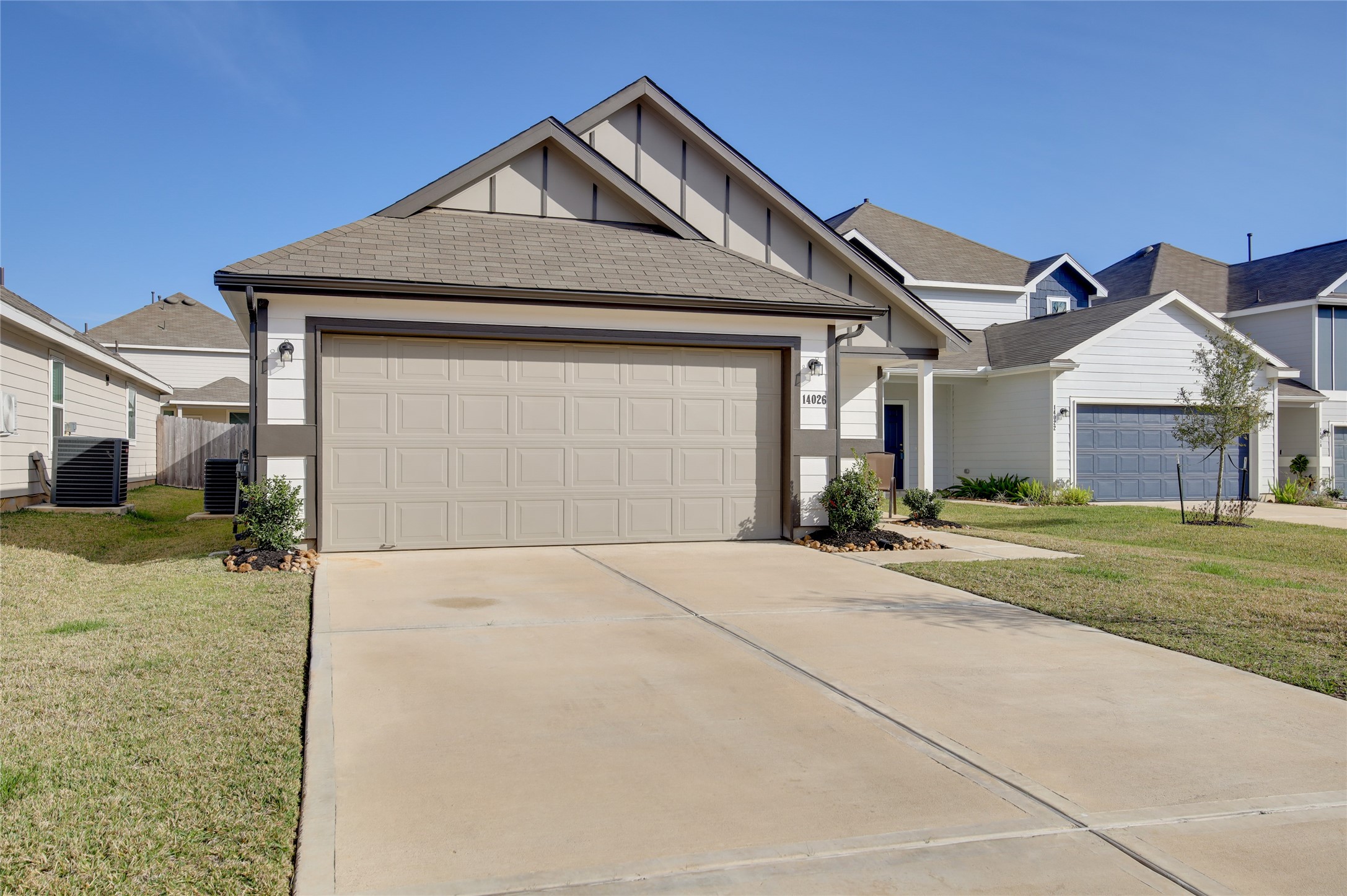 14026 Chinook Drive Conroe, TX 77384 - Photo 4 of 34 a front view of a house with a yard and garage