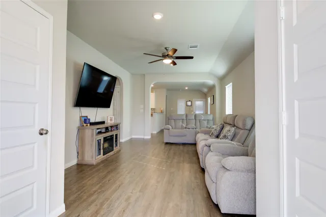 a living room with furniture and a flat screen tv