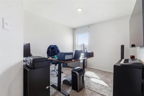 a view of a workspace with furniture