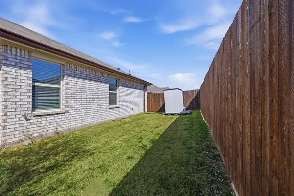 a backyard of a house with lots of green space