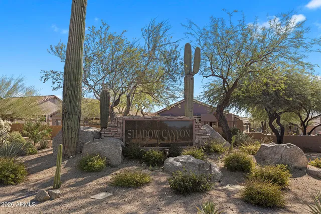 a view of a house with a yard and tree s