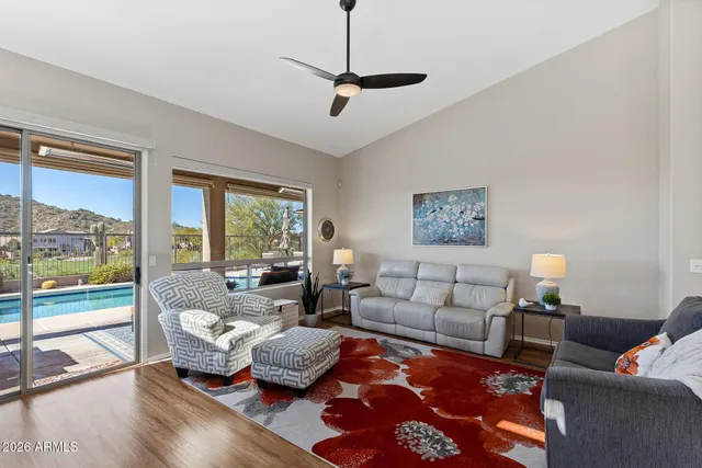 a living room with furniture and a large window