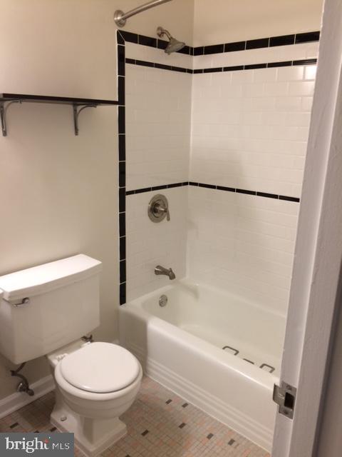 2710 Macomb Street Northwest, Unit 418 Washington, DC 20008 - Photo 3 of 21 a bathroom with a shower and a toilet
