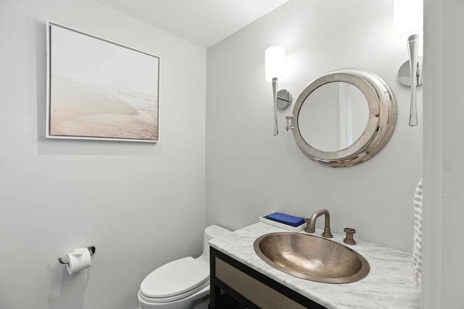 45 Starbuck Road Nantucket, MA 02554 - Photo 19 of 42 a bathroom with a toilet a sink and mirror