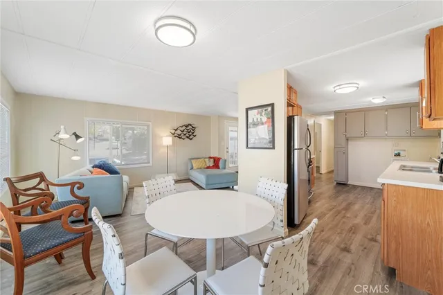 a living room with furniture a dining table and chairs