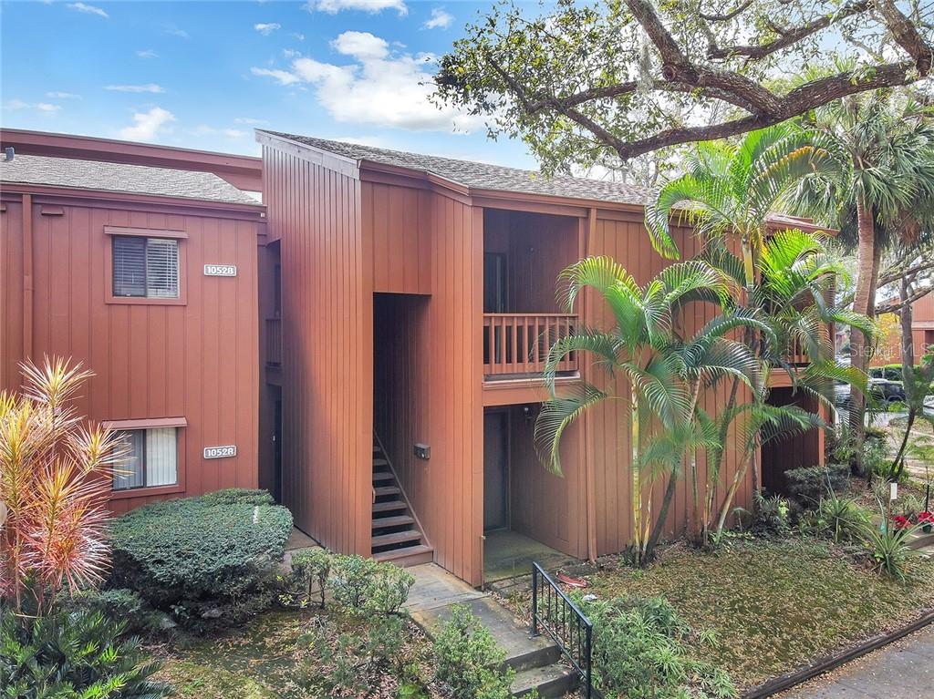 1052 East Michigan Street, Unit 252 Orlando, FL 32806 - Photo 1 of 1 a front view of a house with garden