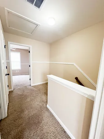 a view of storage and utility room with washer and dryer