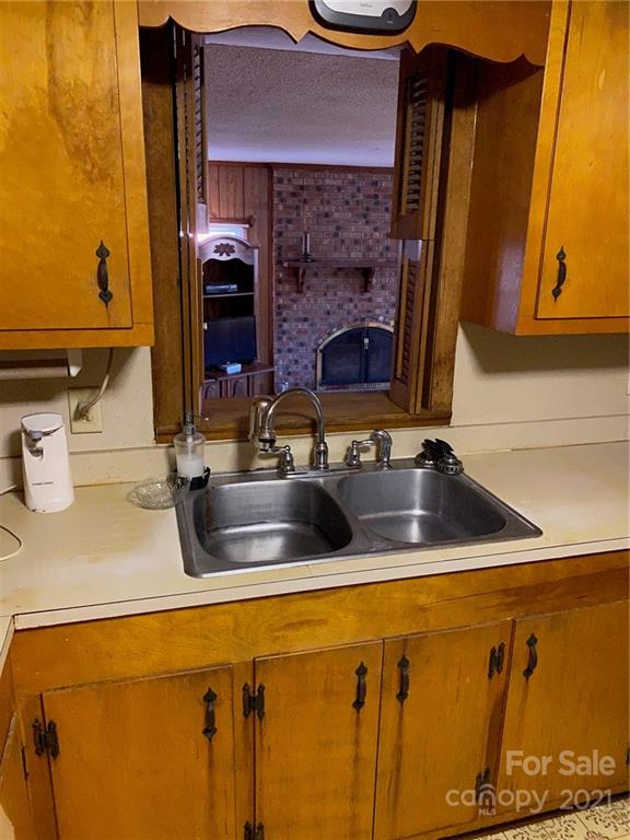 71 Mclendon Road Morven, NC 28119 - Photo 16 of 21 a kitchen with a sink and a refrigerator