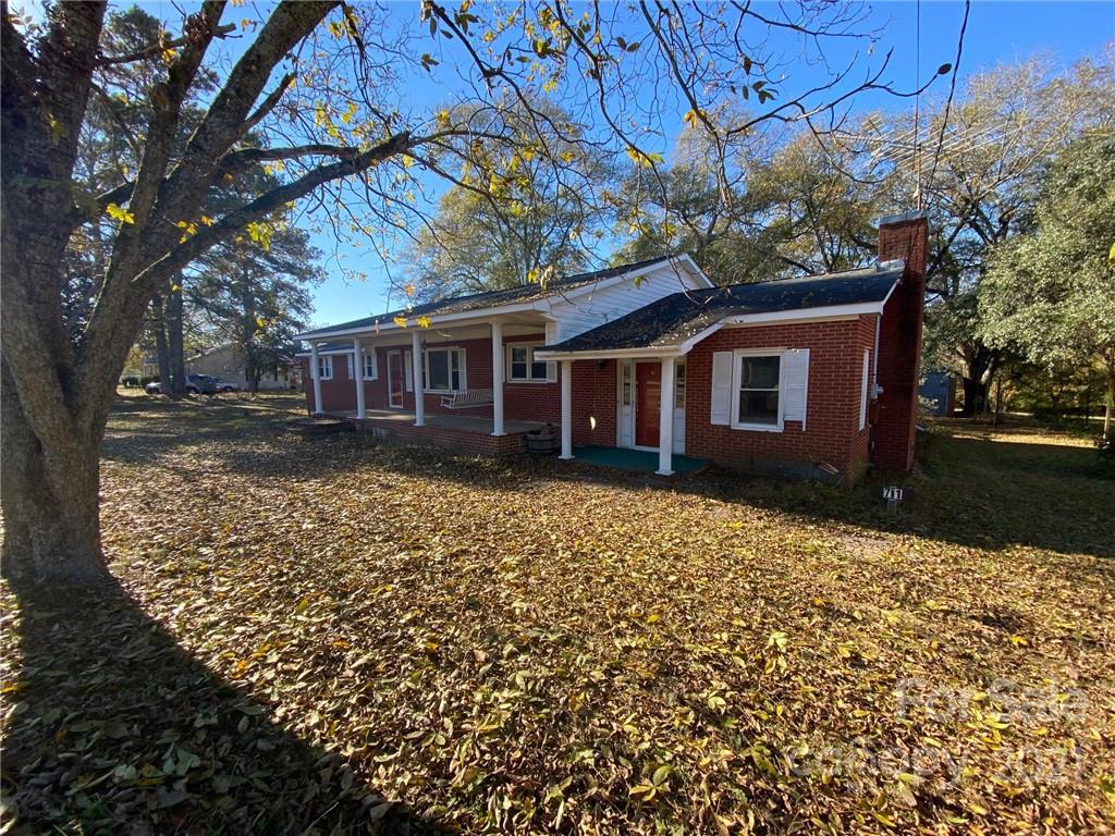 71 Mclendon Road Morven, NC 28119 - Photo 3 of 21 a house with trees in the background