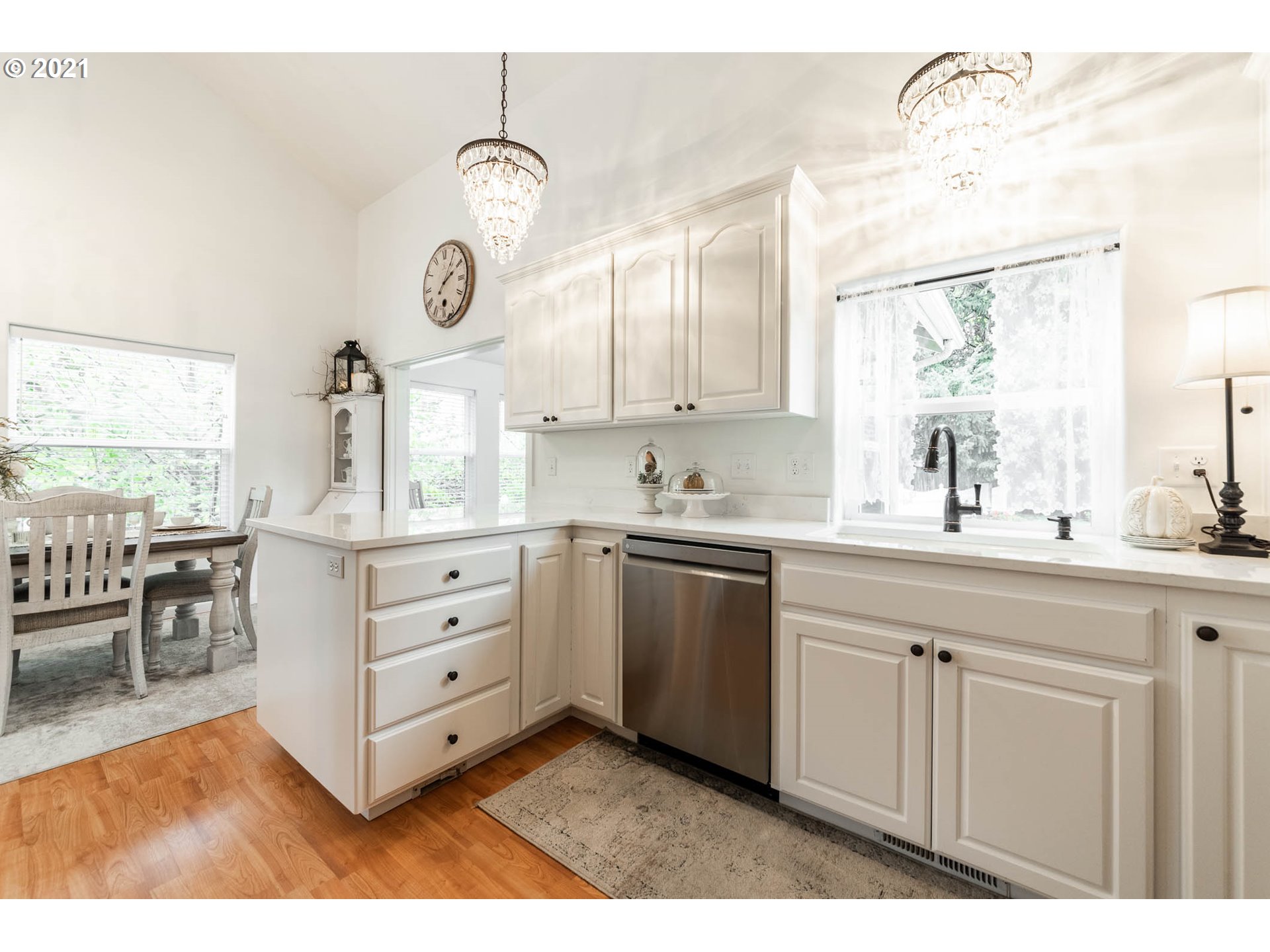 678 63rd Street Springfield, OR 97478 - Photo 11 of 32 a kitchen with white cabinets and sink