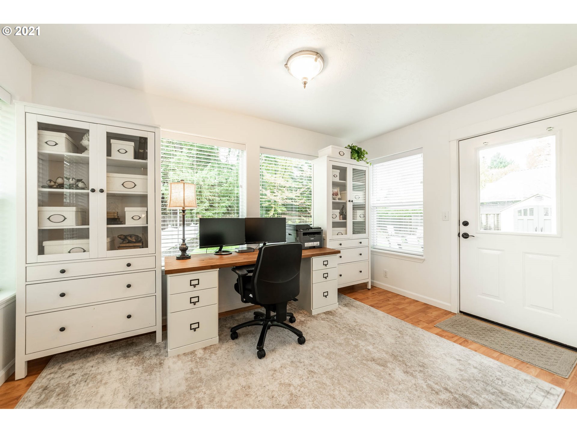 678 63rd Street Springfield, OR 97478 - Photo 12 of 32 a view of workspace with wooden floor and windows