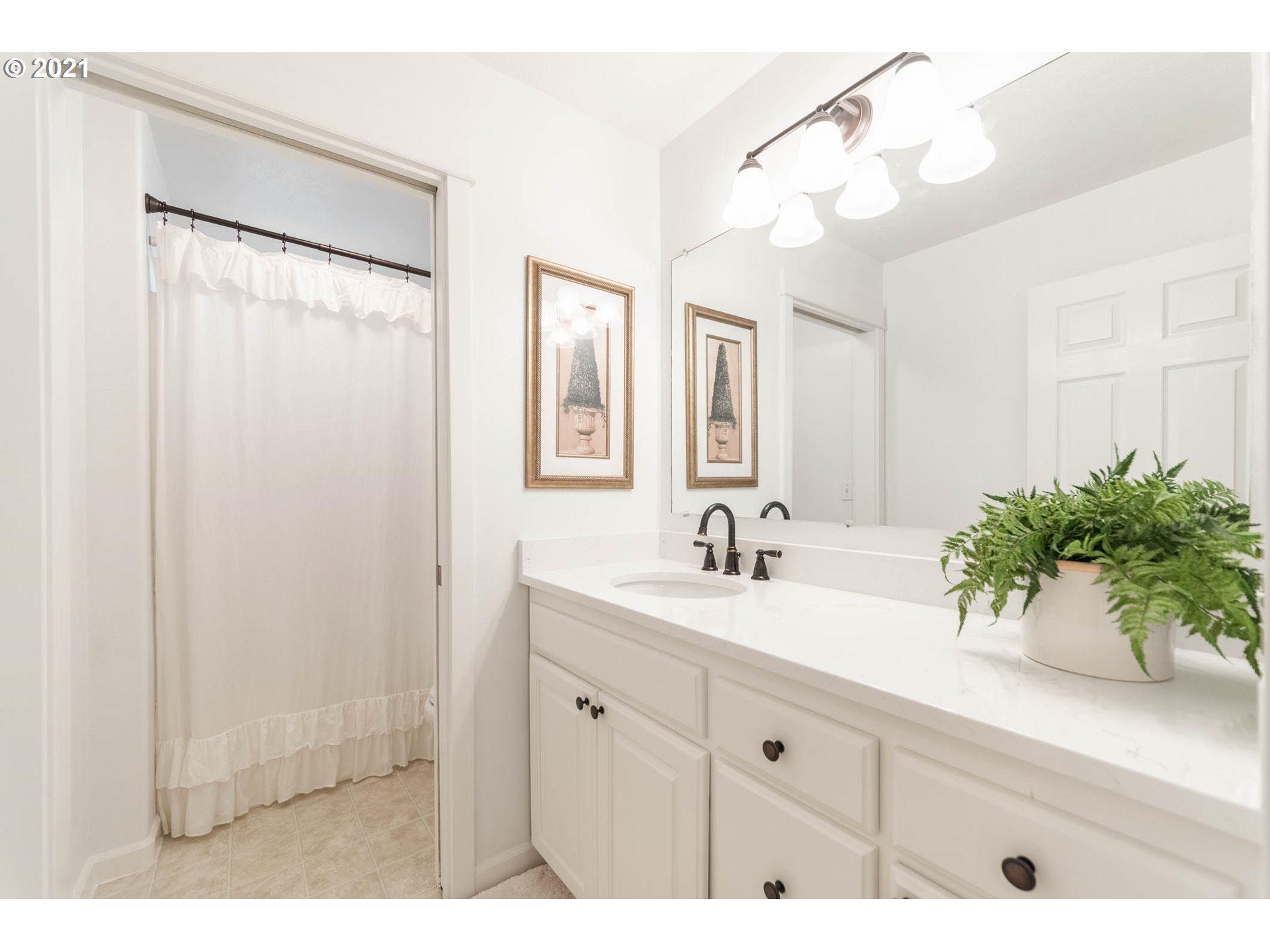 678 63rd Street Springfield, OR 97478 - Photo 18 of 32 a bathroom with a sink a vanity and a mirror
