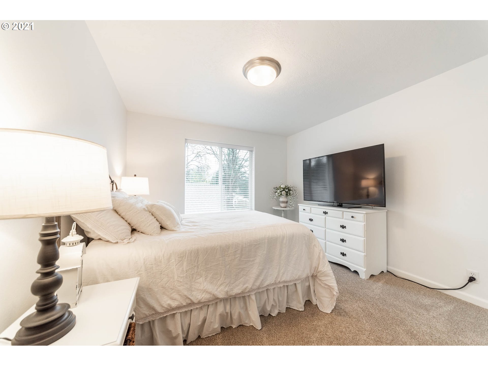 678 63rd Street Springfield, OR 97478 - Photo 23 of 32 a bedroom with a bed and a flat screen tv