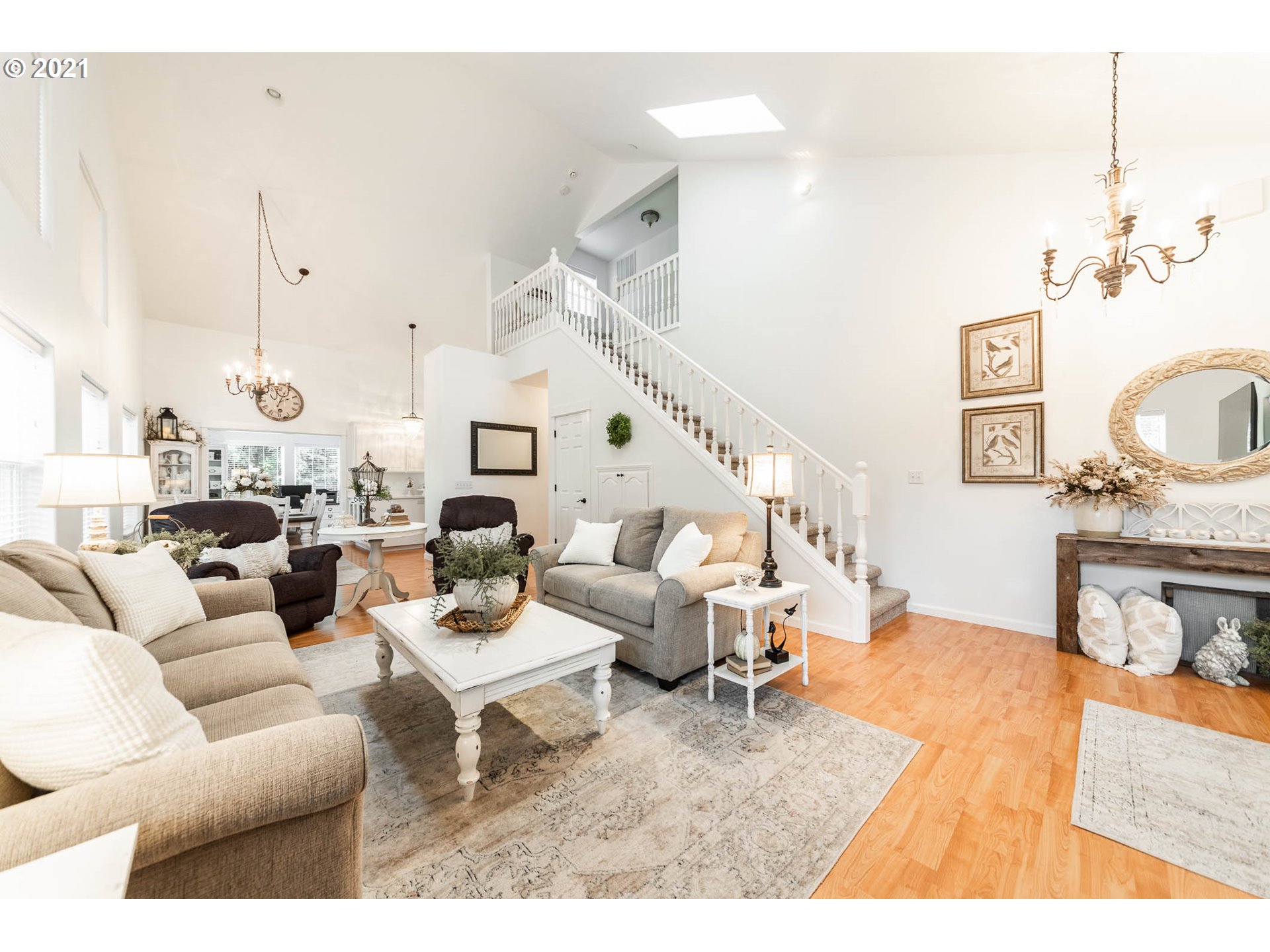 678 63rd Street Springfield, OR 97478 - Photo 5 of 32 a living room with furniture a fireplace and a chandelier