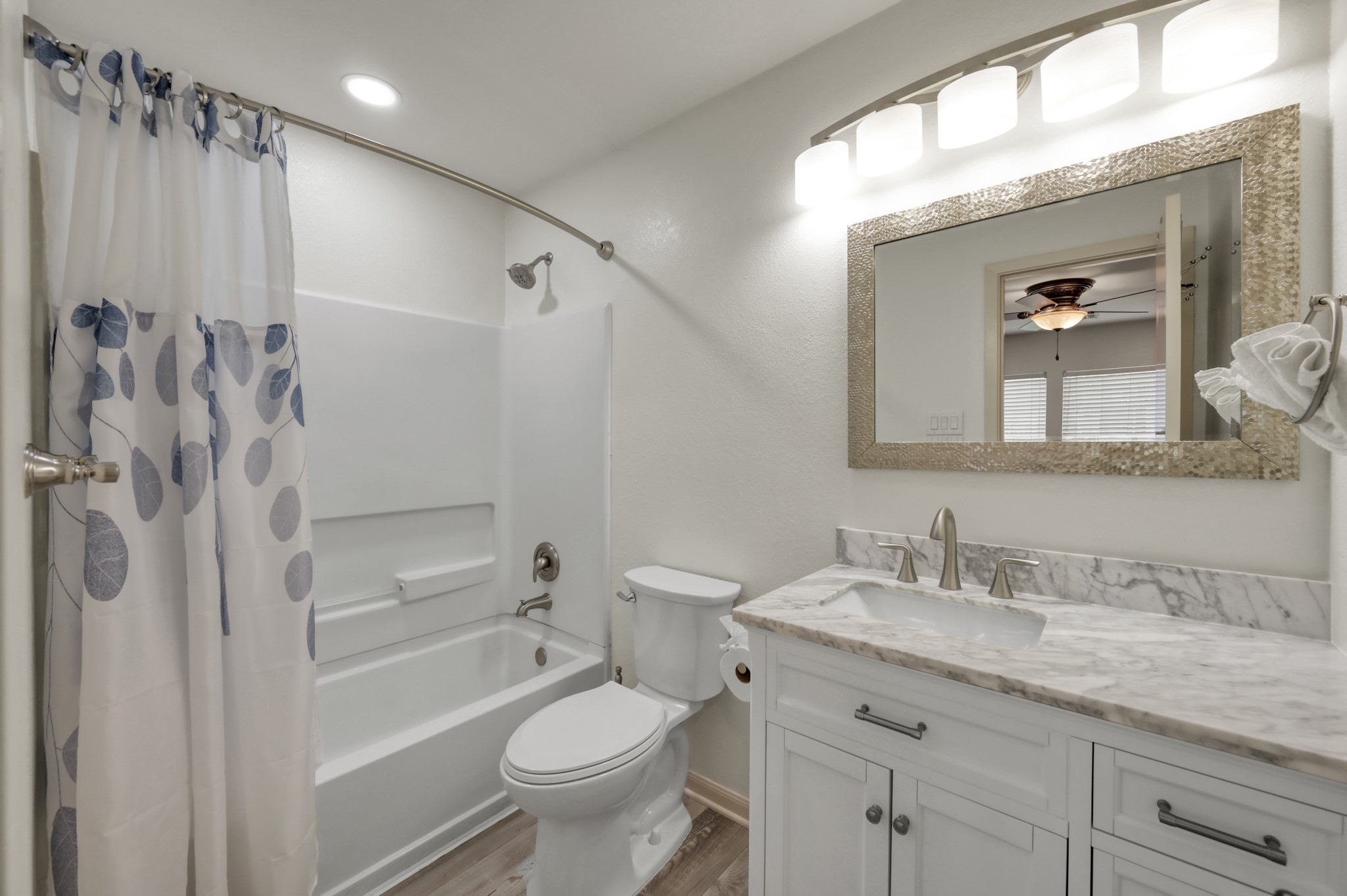 21815 Mossy Field Lane Spring, TX 77388 - Photo 20 of 39 Primary ensuite bathroom with a tub/shower combo featuring upgraded vanity, mirror, and lighting.