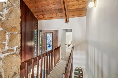 a view of balcony with deck and wooden floor