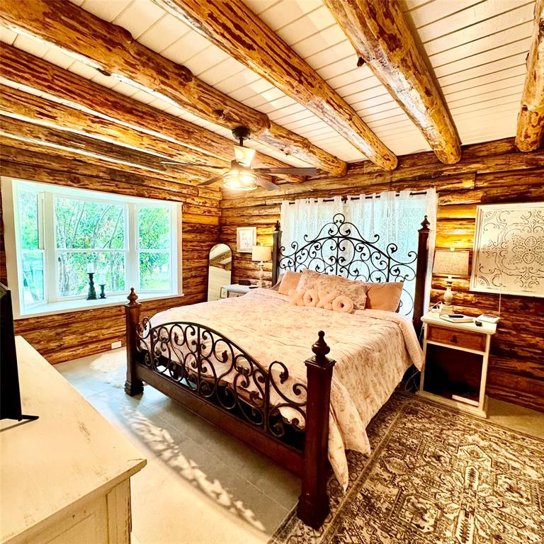 104 Advance Road Weatherford, TX 76088 - Photo 11 of 38 a bed sitting in a bedroom next to a window