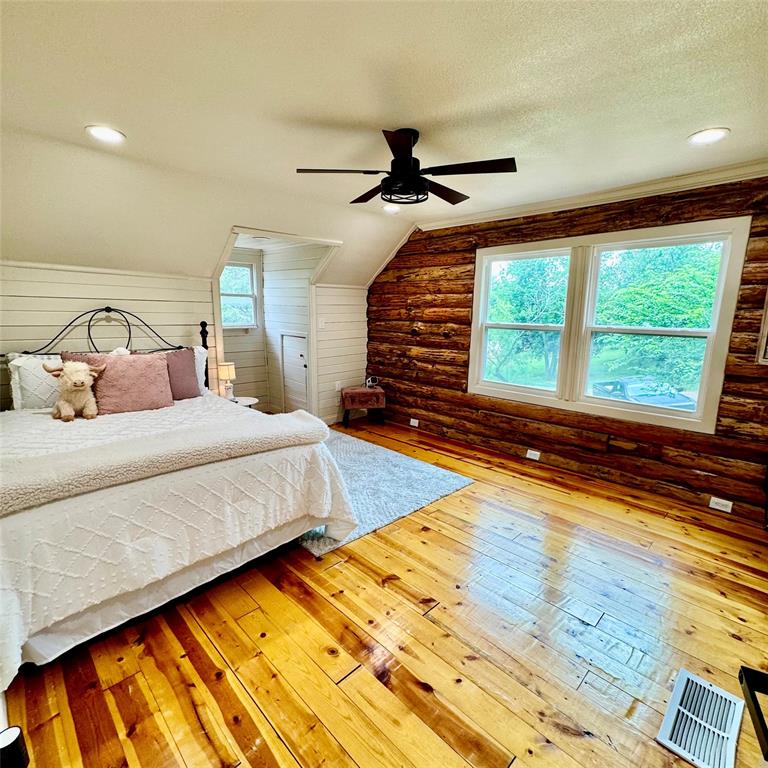 104 Advance Road Weatherford, TX 76088 - Photo 23 of 38 a bedroom with a bed and a large window