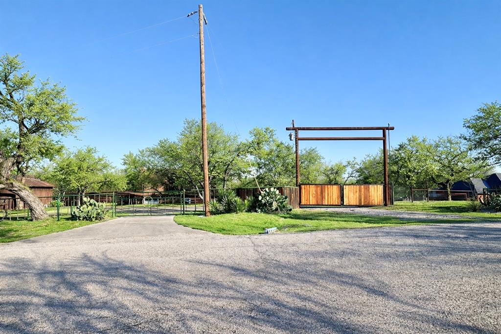 104 Advance Road Weatherford, TX 76088 - Photo 30 of 38 a view of a house with a big yard and a big yard