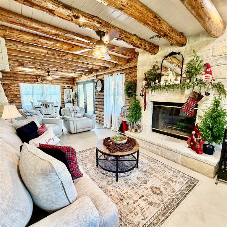 104 Advance Road Weatherford, TX 76088 - Photo 3 of 38 a living room with furniture and a fireplace
