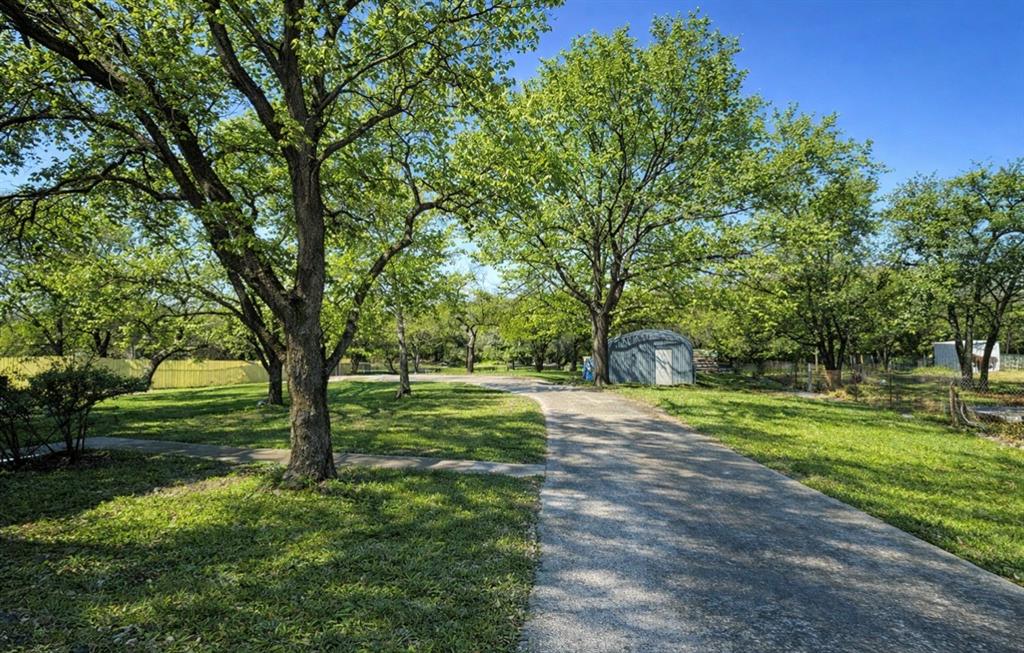 104 Advance Road Weatherford, TX 76088 - Photo 36 of 38 a view of a field with a tree